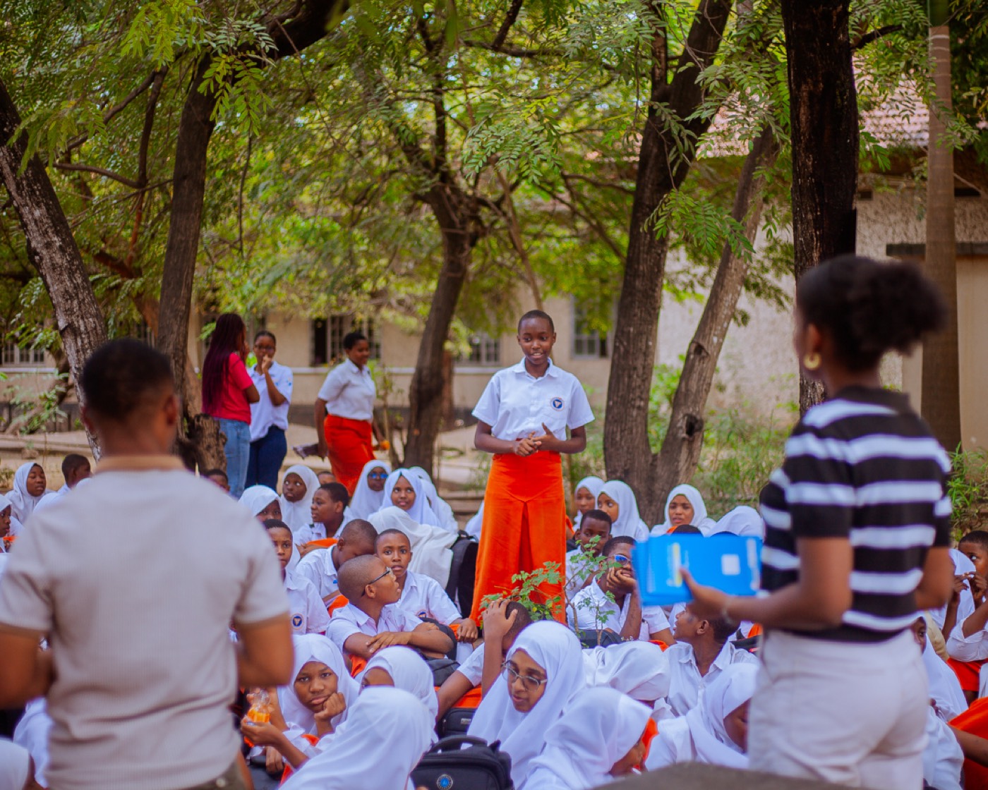A student stands to share her thoughts in front of her classmates