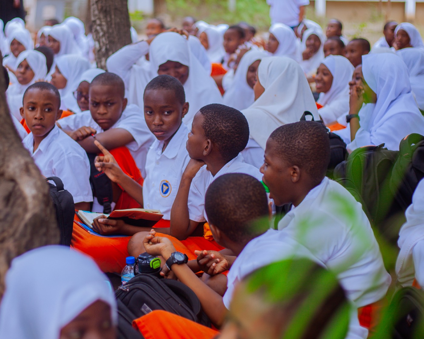 Students lean in and gesture during an open conversation