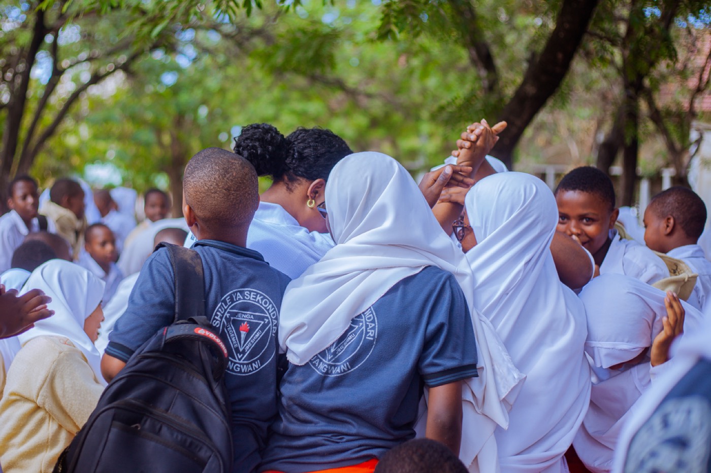 Students share a warm embrace during the outreach