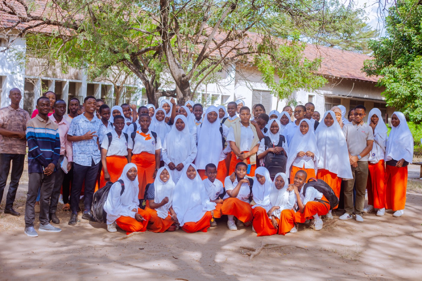 Students and the GROW team gather for a group photo at Jangwani Secondary School