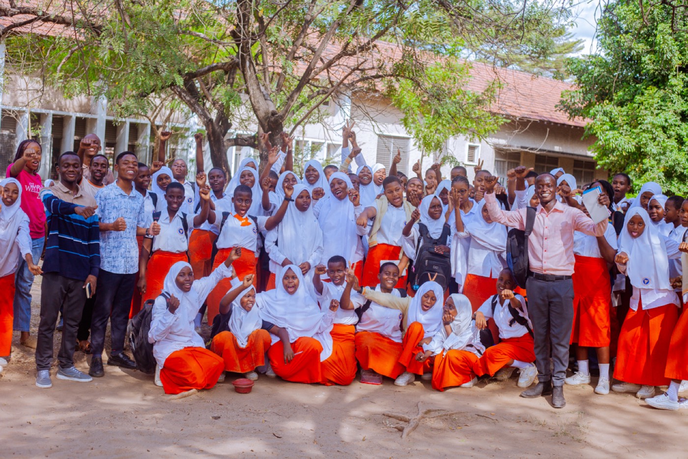 Students and the GROW team cheer together at the close of the outreach
