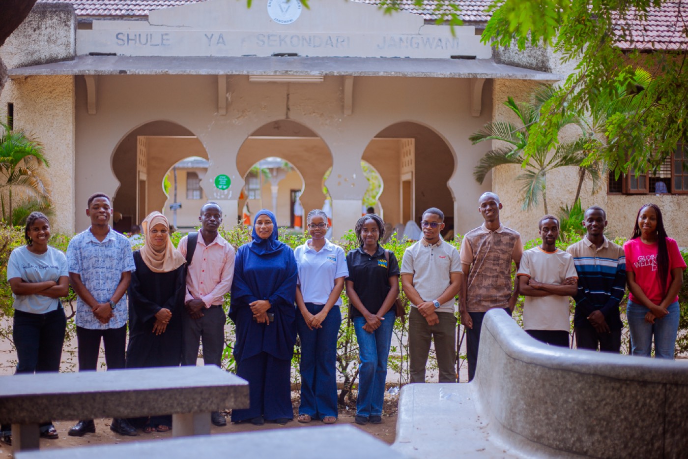 The GROW team poses together outside Jangwani Secondary School